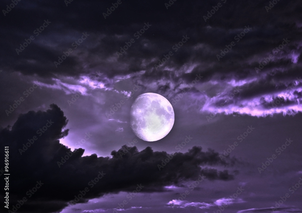 The moon in the night sky in clouds The moon in the night sky in clouds