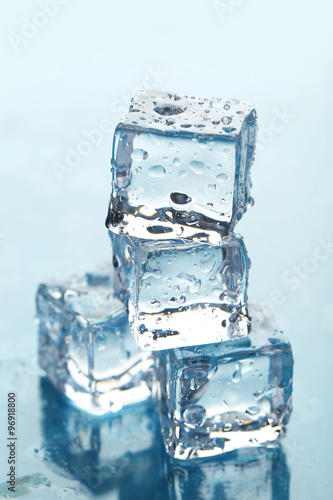 Ice cubes on blue background