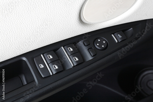 Car interior. Doors. Control button photo