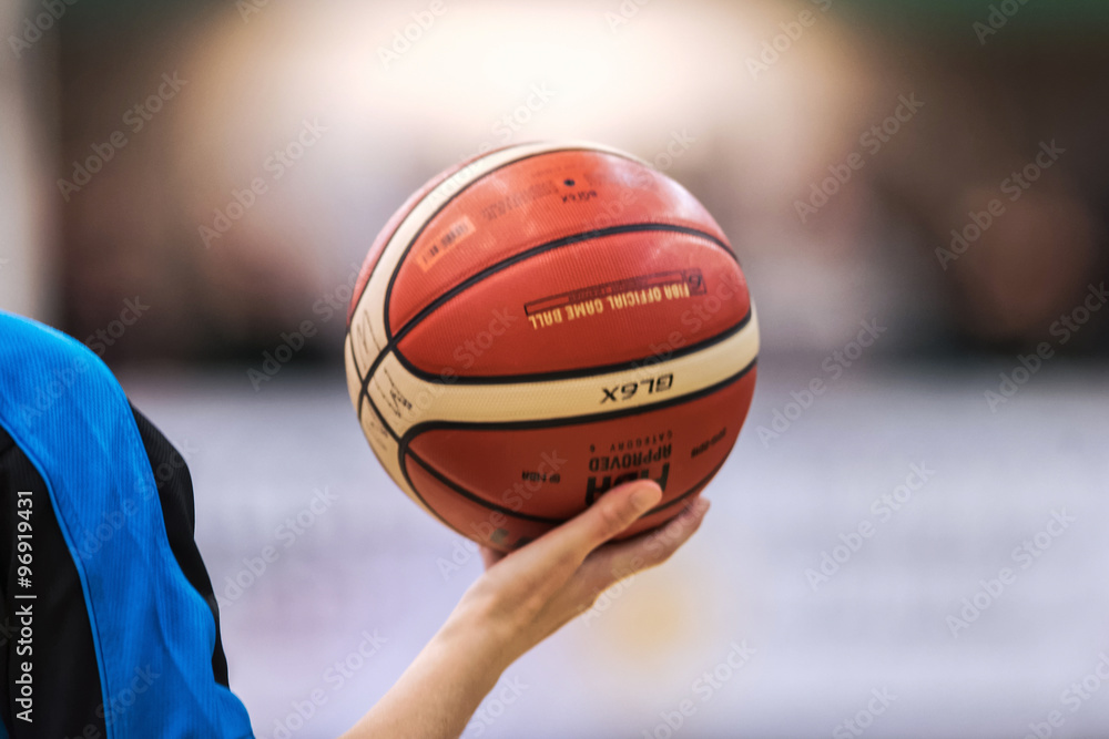 Obraz premium Closeup of referee holding ball at the Women European Basketball
