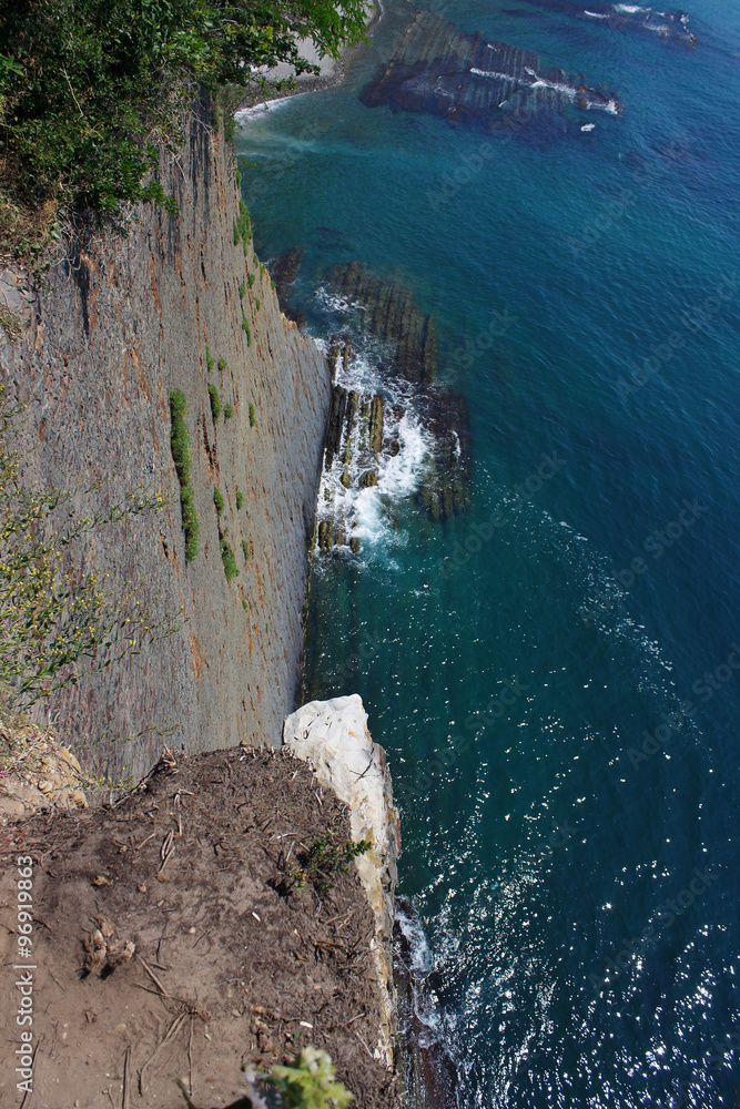 Dizzying view from the high cliffs down to the sea