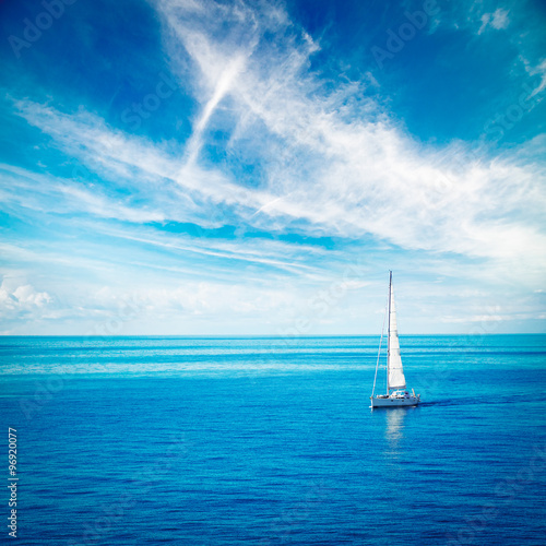 White Yacht Sailing in Blue Sea