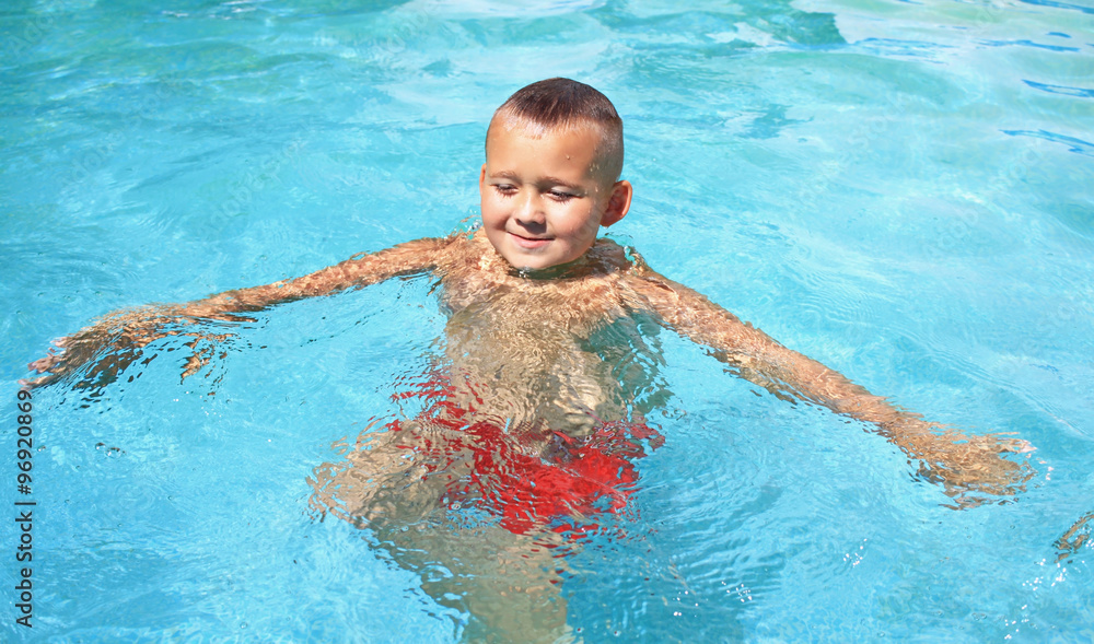 Little Boy in swimming pool. 