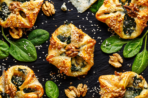 Spinach puffs with addition of gogonzola cheese, walnuts and sesame seeds