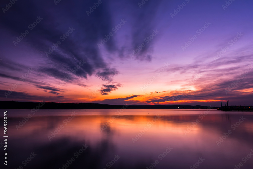 Dramatic long exposure landscape lake sunset
