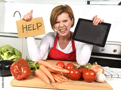 Фотография inexperienced home cook woman in red apron screaming desperate and frustrated at