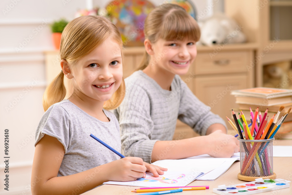 Fototapeta premium Pleasant little girl drawing