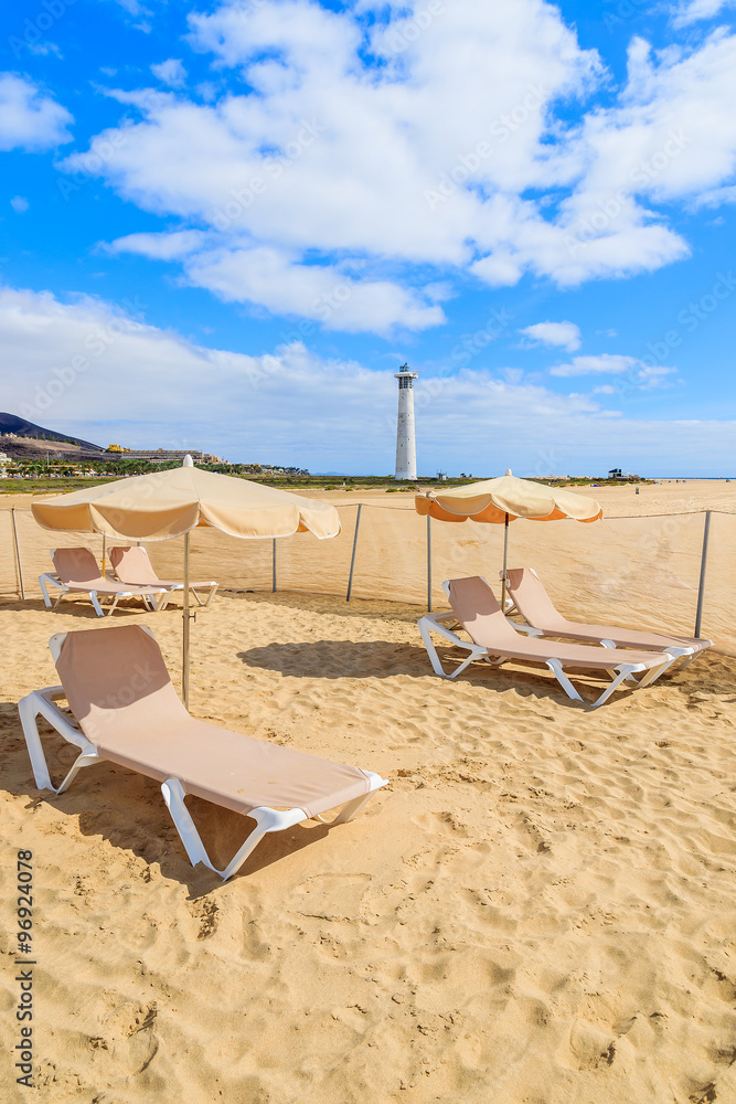 Sunbeds with umbrellas on Jandia beach, Fuerteventura, Canary Islands, Spain