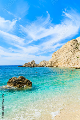 View of crystal clear turquoise sea with rock cliffs on Kefalonia island beach, Greece