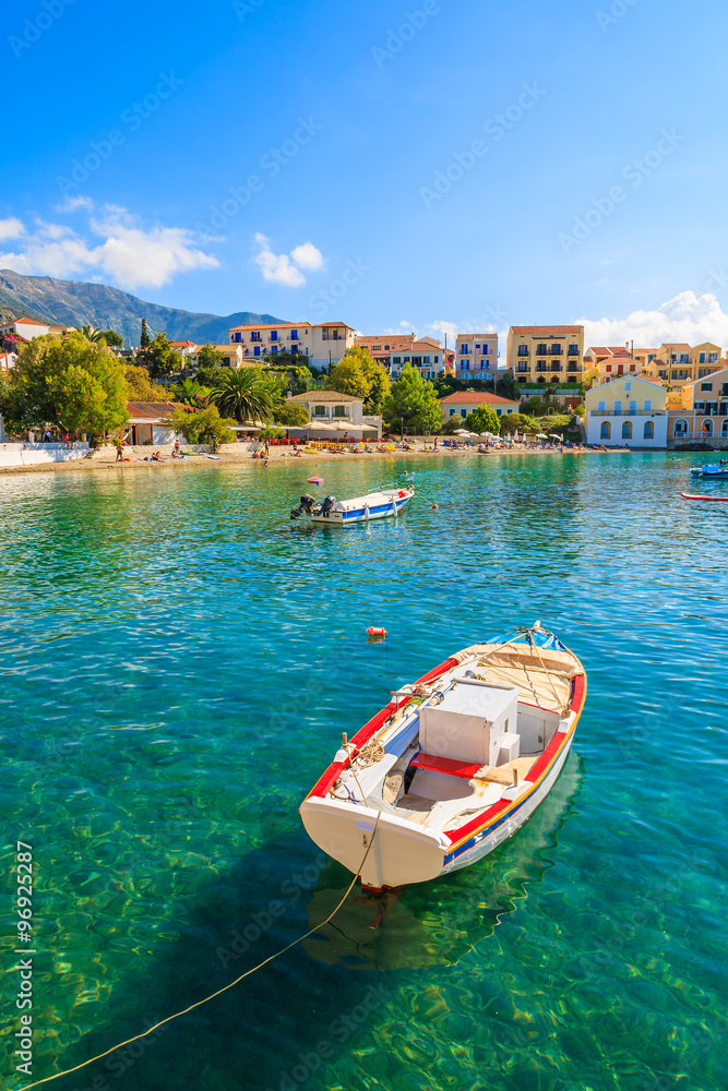 Greek fishing boat on sea in beautiful bay, Assos village, Kefalonia island, Greece