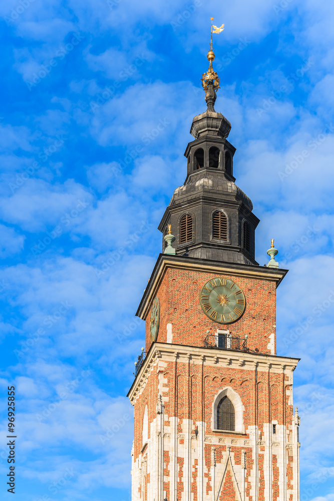 City Hall tower against blue sky on main market square of Krakow, Poland