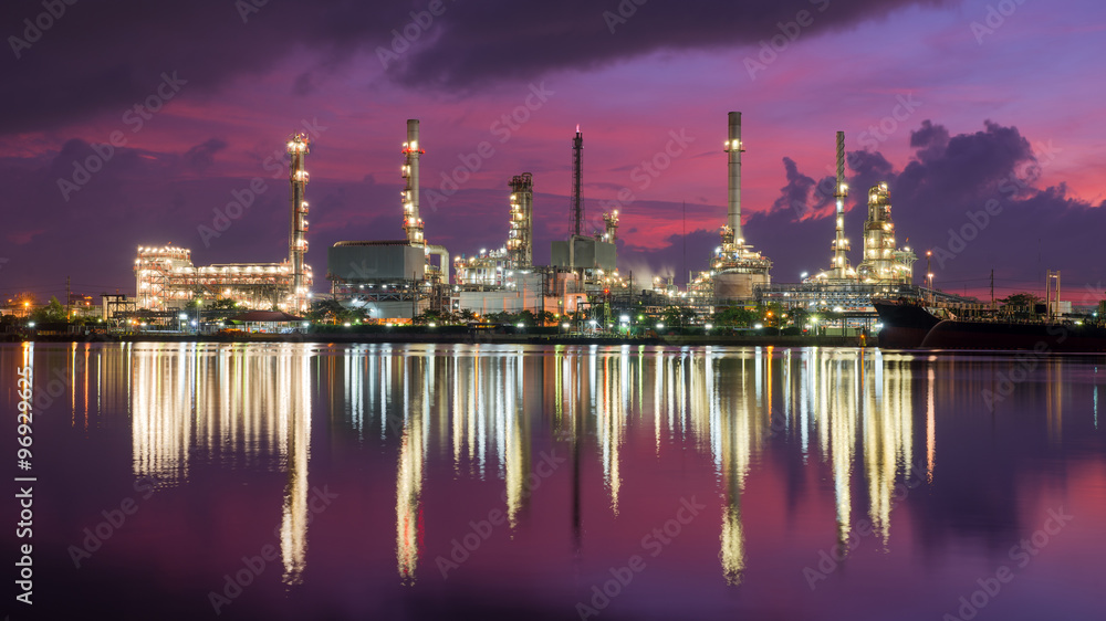 Oil tank ship mooring in oil refinery industry at twilight time