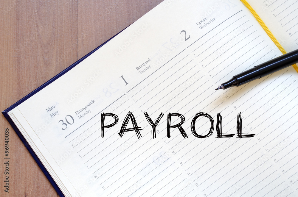 Payroll write on notebook Payroll write on notebook