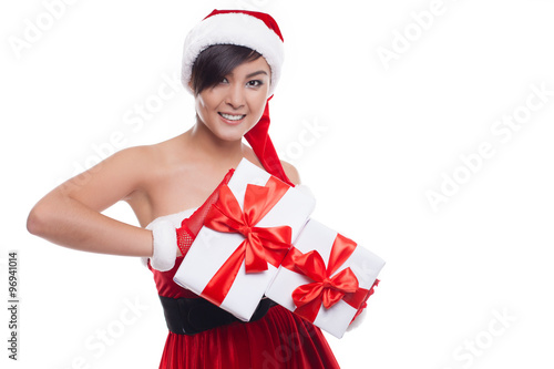 Christmas asian woman holding christmas gifts smiling happy
