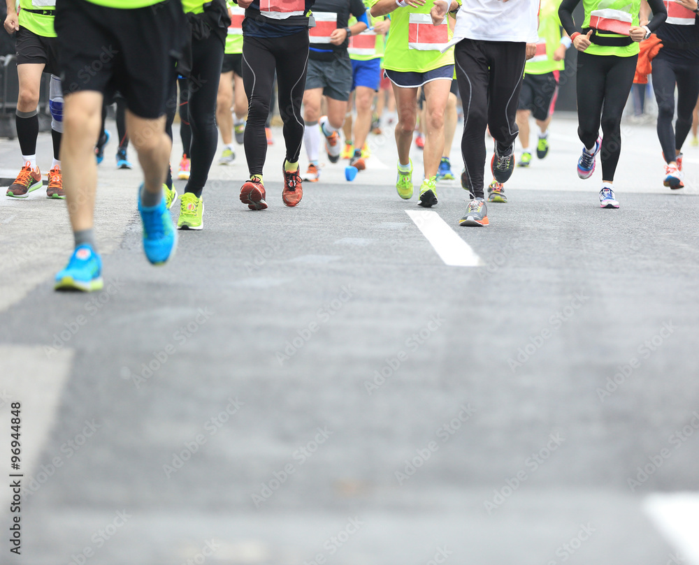 Marathon running race, people feet on city road