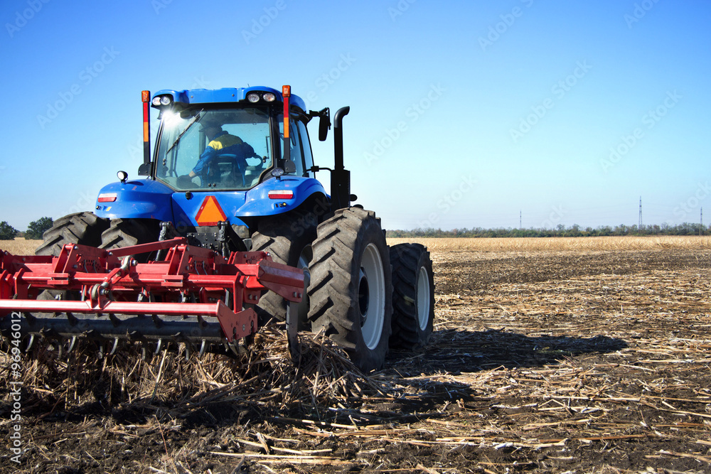 Farmer on a tractor plowed field Farmer on a tractor plowed field