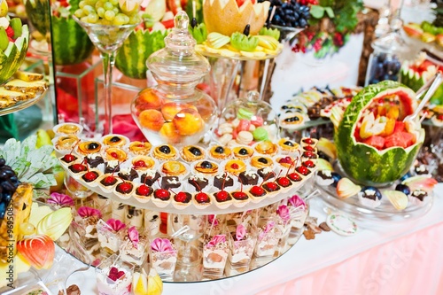 Wedding reception. Table with fruits and sweets