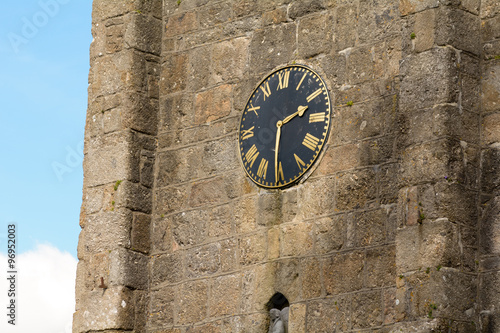 The Clock Tower at the Chursh of St Michael the Archangel in Chagford, Devon, England photo