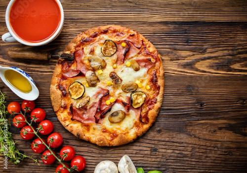 Delicious italian pizza served on wooden table #96952676