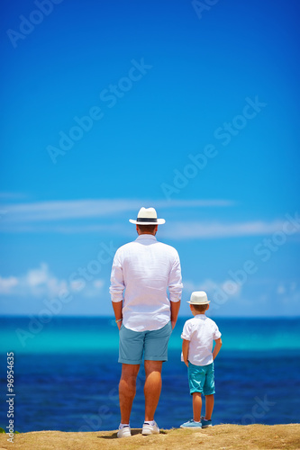 Canvas Print father and son on summer vacation near the seaside