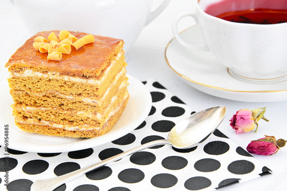 Cake with Condensed Milk, Nuts and Honey. Tea, Tableware. Cake with Condensed Milk, Nuts and Honey. Tea, Tableware.