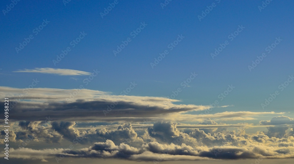Autumn clouds with blue sky background