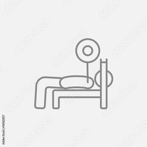 Man lying on bench and lifting barbell line icon.
