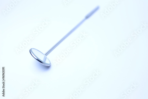 Steel laryngeal mirror in the light-box  