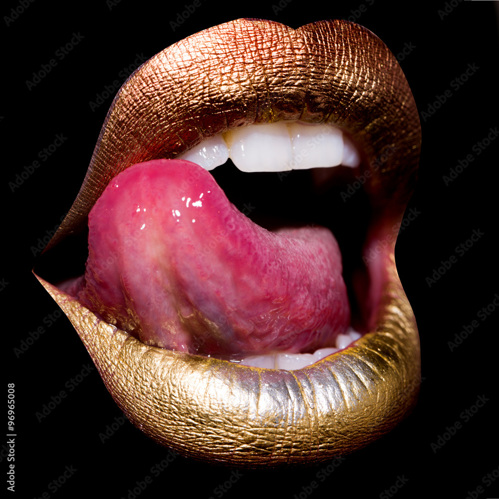 Fotografie Lips with tongue on black