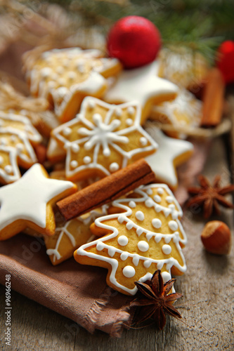Cookies with spices and Christmas decor, on wooden table