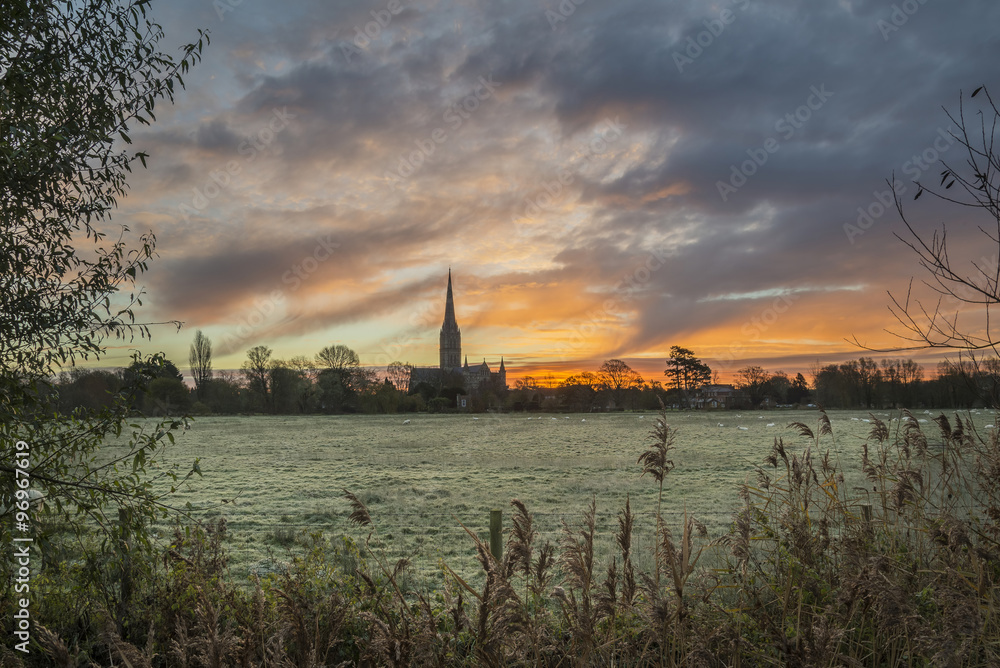 Winter frosty sunrise landscape Salisbury cathedral city in Engl
