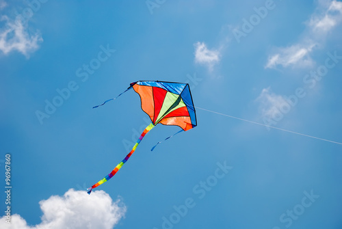 colorful kite flying in the wind photo