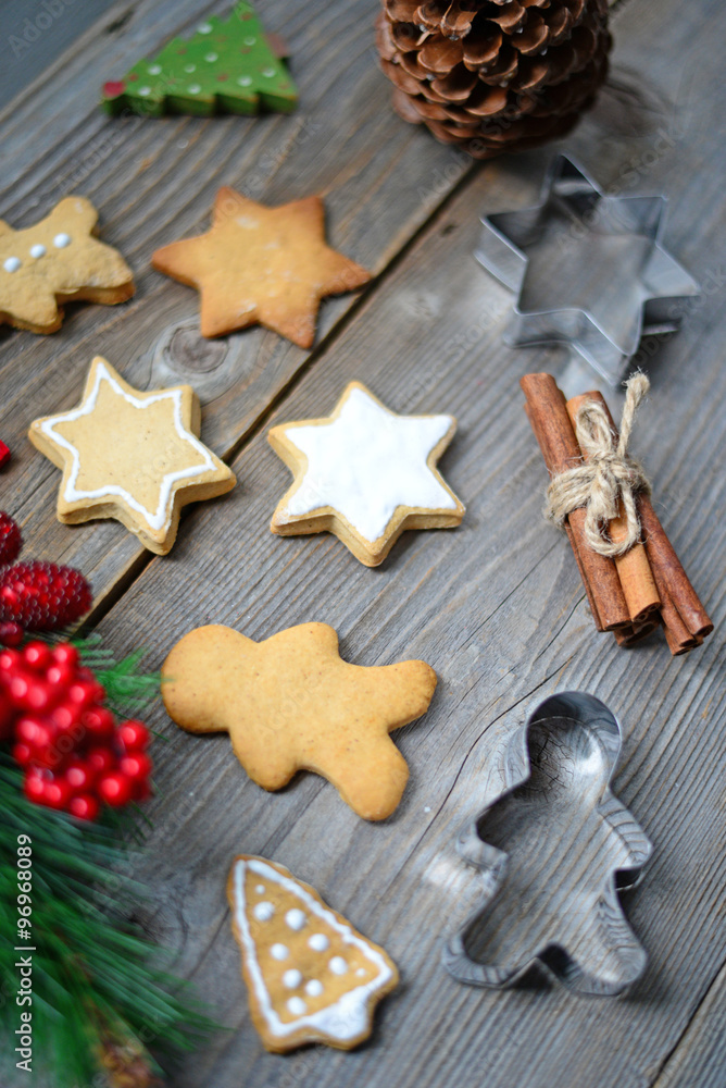 Christmas cookies and cinnamon on wooden table Christmas cookies and cinnamon on wooden table