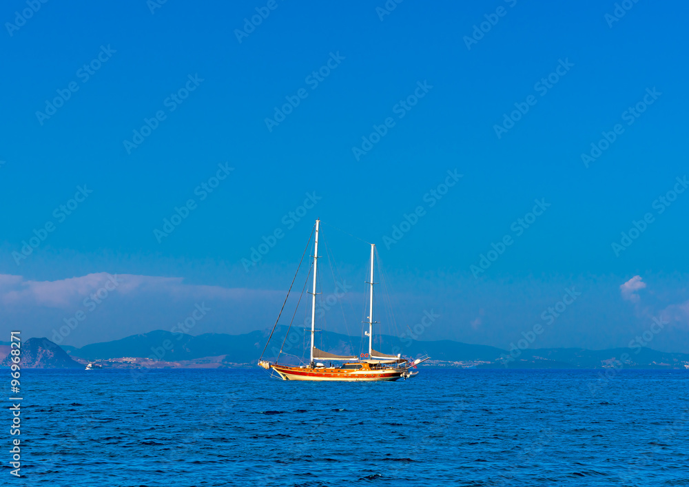 wooden sailing yachts docked out of the main port of Kos island in Greece