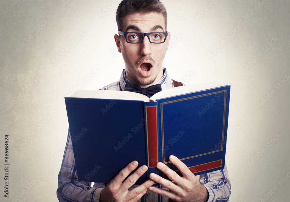beautiful young genius surprised founding his idea on book beautiful young genius surprised founding his idea on book