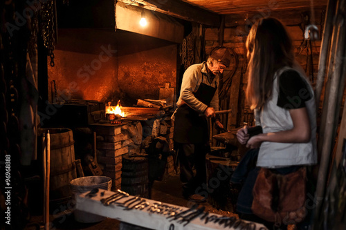 Farrier at work in a forge