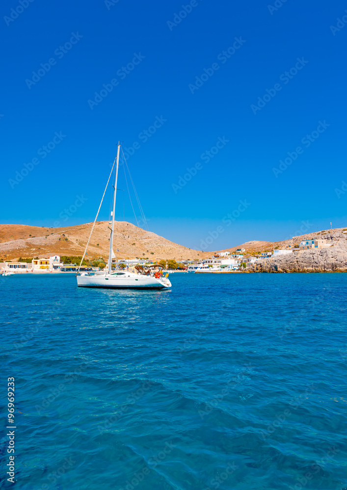 sailing boat docked in the gulf of Pserimos island in Greece sailing boat docked in the gulf of Pserimos island in Greece
