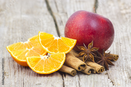 fruits and spises on wooden background