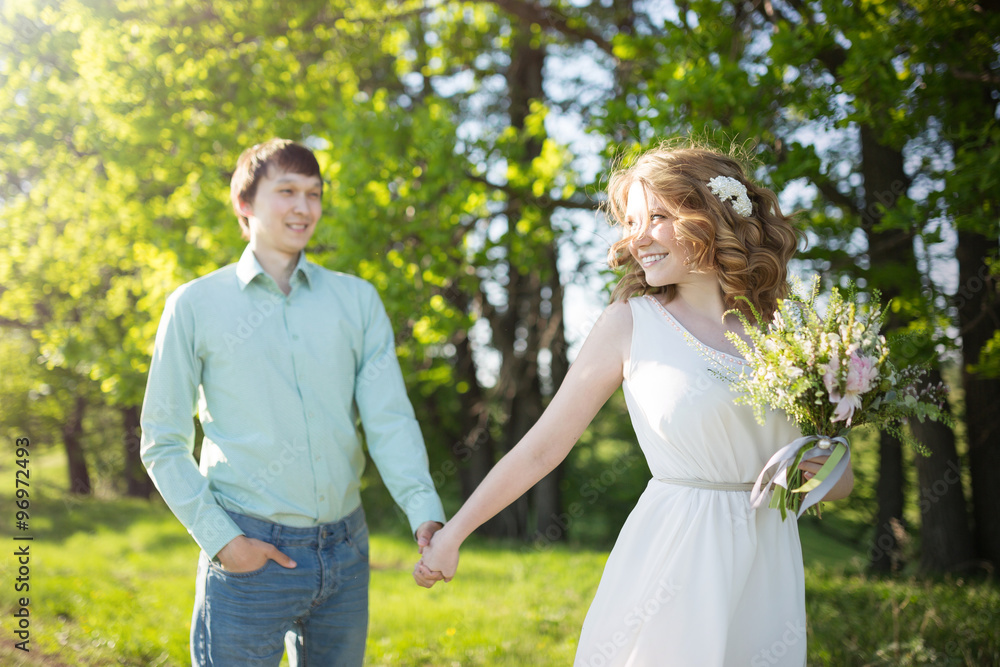 Young couple in love walking, spring park