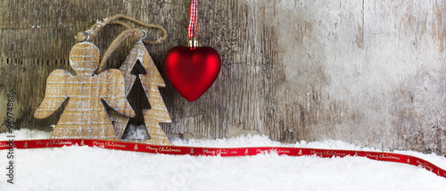 Christmas postcard with wooden background and snow