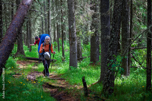 Company of young people are hiking in Altai mountains