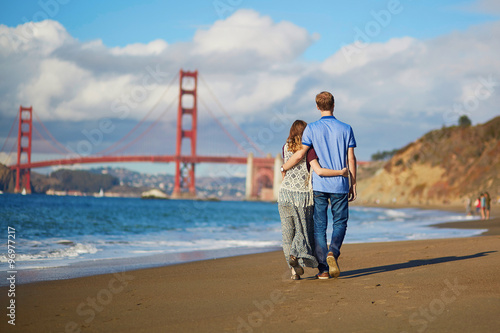 Photos Romantic loving couple having a date on Baker beach in San Francisco