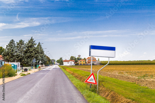Obraz na plátně Blank signs on village entry