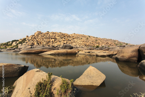 Landscape with granite rocks at Chakratirtha Lake in Hampi, Karnata, India (Asia) photo