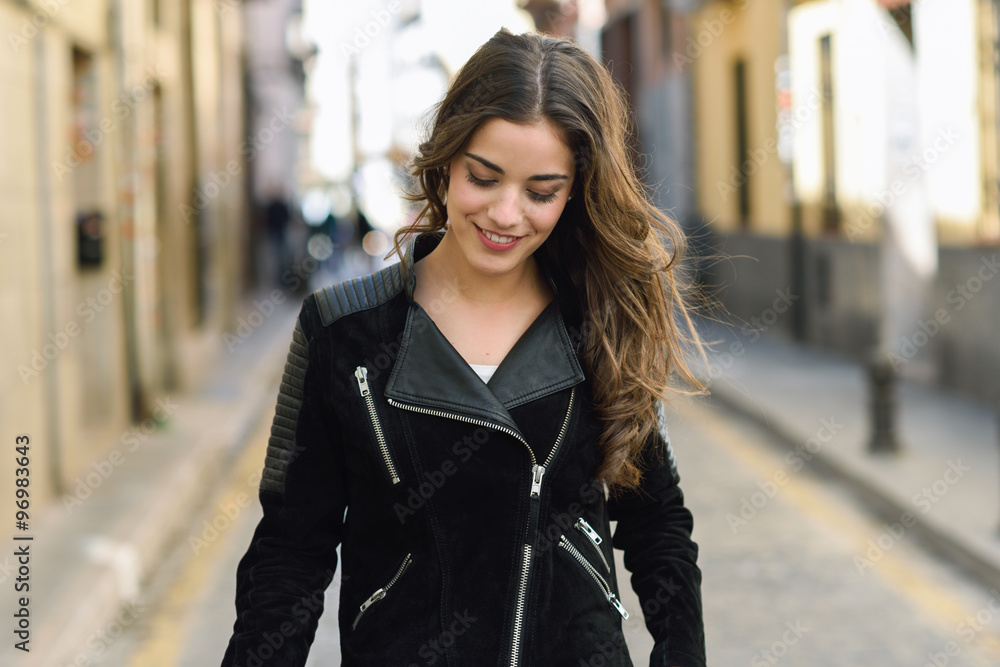 Woman in urban background wearing casual clothes Woman in urban background wearing casual clothes