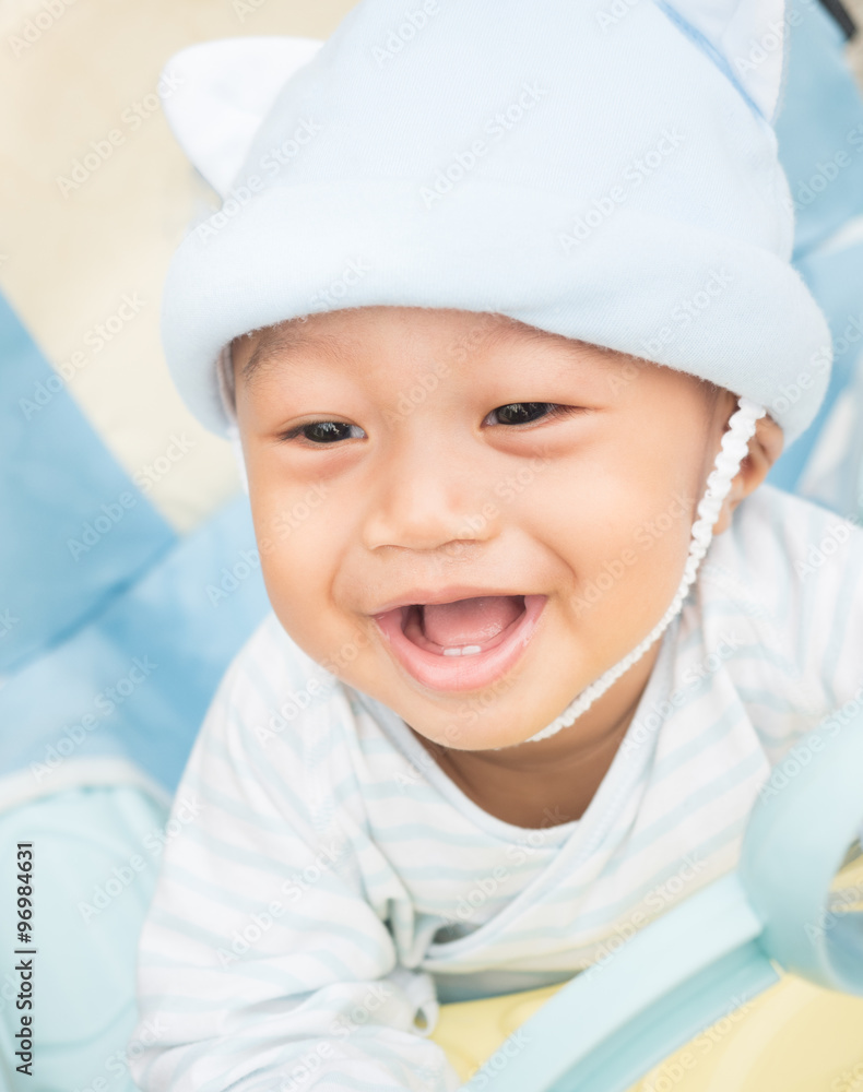 Baby boy smiling and showing his first teeth Baby boy smiling and showing his first teeth