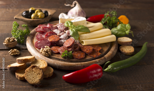 appetizer with sausages and cheese and nuts
