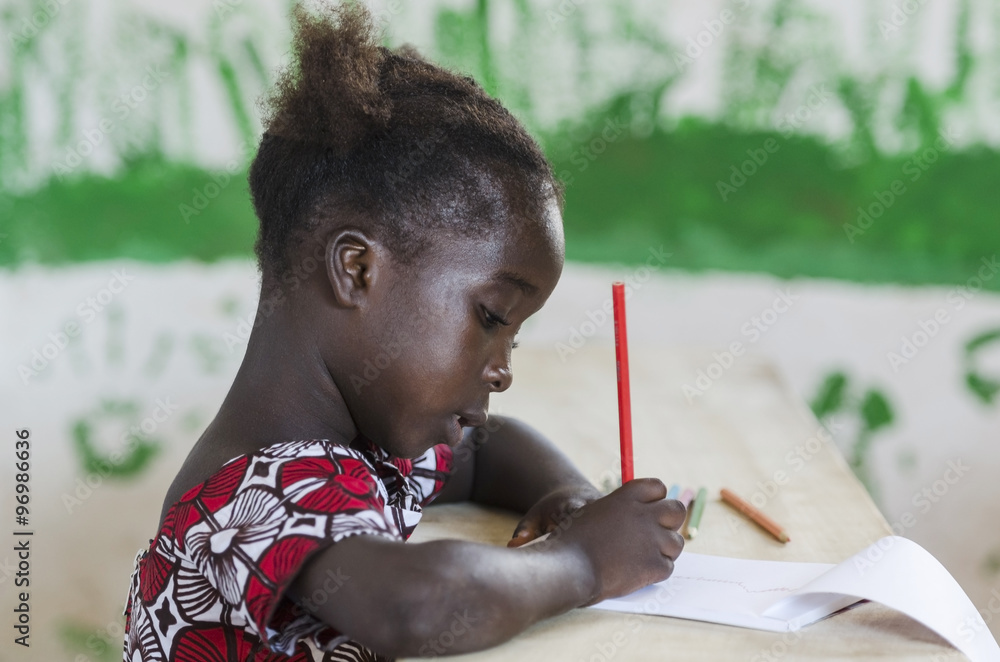 Young Gorgeous Black Child at School Writing Symbol Stock Photo | Adobe