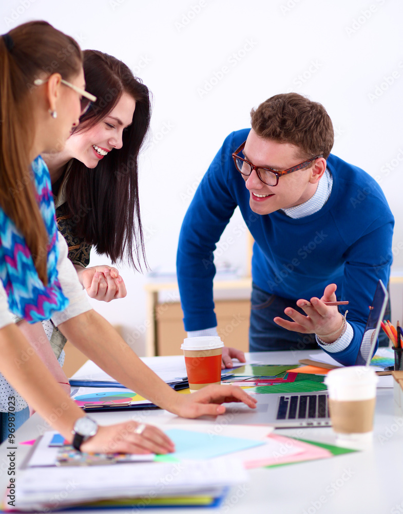 Young business people working at office on new project Young business people working at office on new project