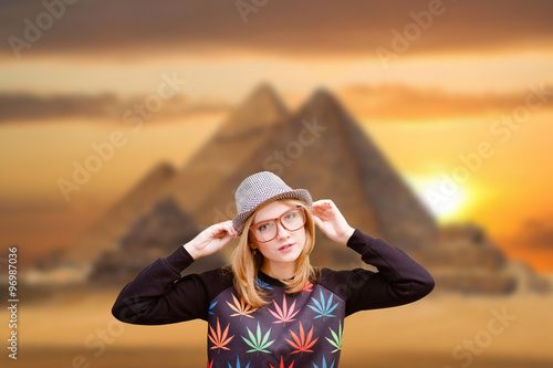 Happy young woman smiling on pyramid background